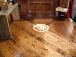 From the Interior Design Show, Toronto, 2010 A sample of my hand-scraped floor, and inlaid walnut monogram medallion.